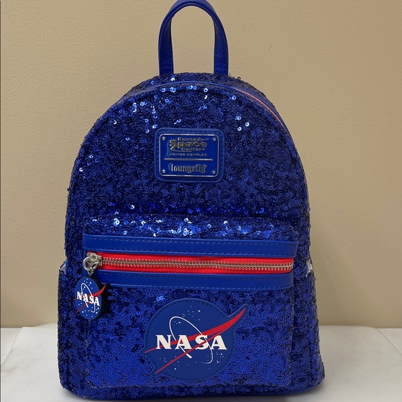 Loungefly Handbags - Loungefly Sequin Kennedy Space Center NASA Bag/Backpack NWT